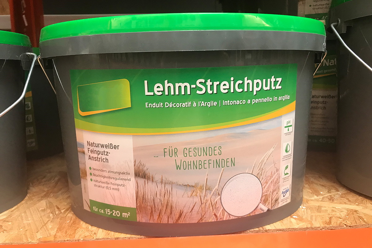 Translation: "Oplossingen bouwmaterialensector: Digitale druketiket op verfemmer, motief leemstuc.