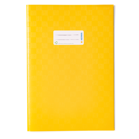 Gelbes Notizbuch mit einer weißen Etikette auf der Vorderseite, die Platz für Beschriftungen bietet.