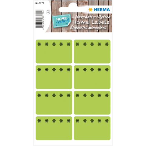 Grüne Etiketten mit schwarzen Blütenmotiven, auf einem Bogen angeordnet. Ideal für die Beschriftung von Haushaltsgegenständen.