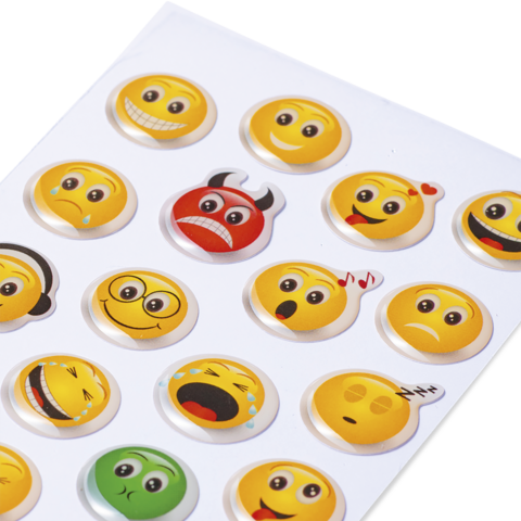 Bogen mit verschiedenen Emoji-Stickern, darunter lächelnde, traurige und wütende Gesichter in verschiedenen Farben und Ausdrücken.