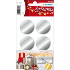 Silberne runde Aufkleber auf einem Bogen, geeignet für Dekoration oder Geschenke. Verpackt mit Weihnachtsgeschenken im Hintergrund.