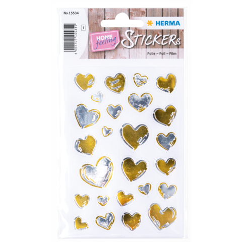 Aufkleber mit verschiedenen Herzen in Silber und Gold auf einem weißen Hintergrund, verpackt für den Verkauf.